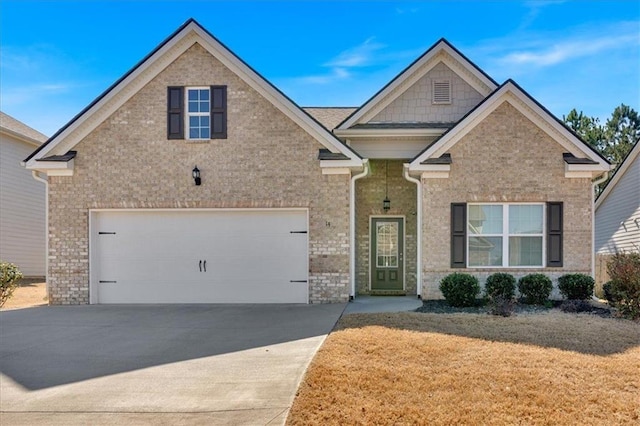 view of front facade featuring brick siding, concrete driveway, and a front lawn