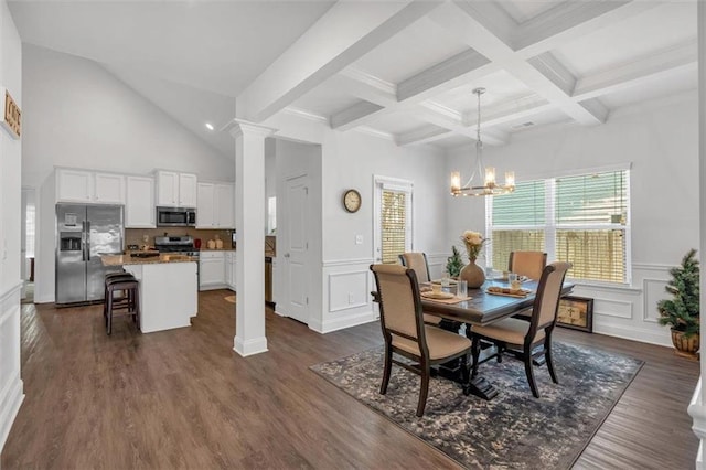 dining space with decorative columns, beam ceiling, dark wood finished floors, and a chandelier