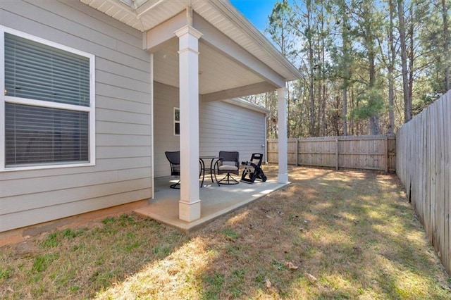 view of yard with a patio area and a fenced backyard