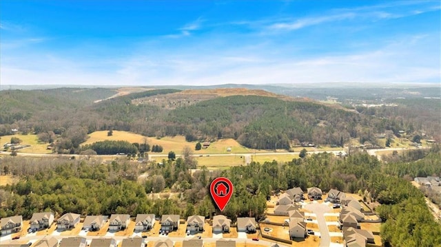 birds eye view of property with a view of trees and a residential view