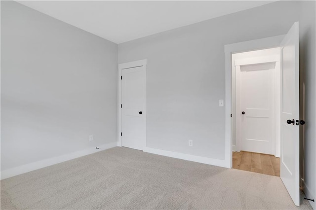 empty room featuring light carpet