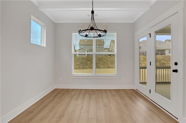 bedroom with light carpet and a tray ceiling