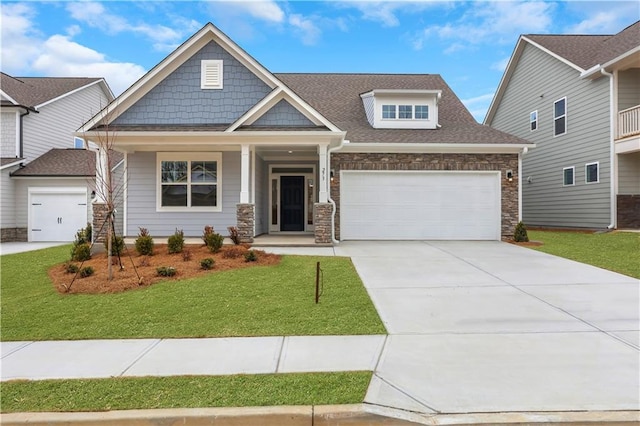 craftsman house with a front yard and a porch