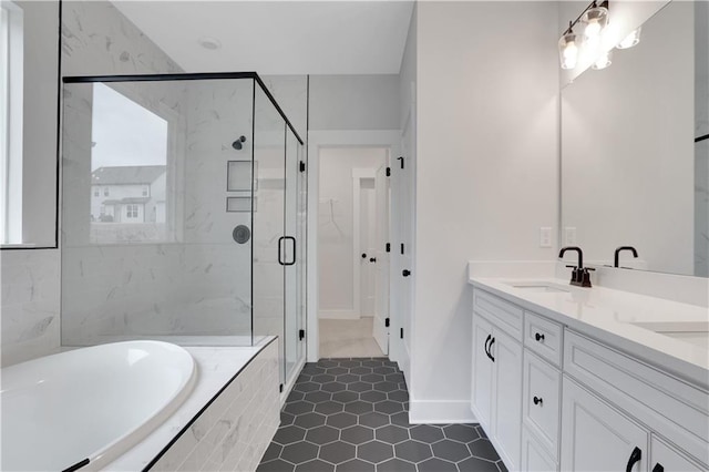 bathroom featuring vanity and shower with separate bathtub