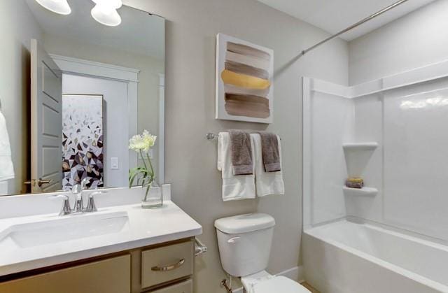 full bathroom featuring vanity, bathtub / shower combination, and toilet