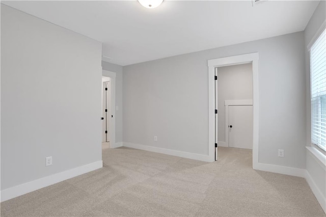 empty room with light colored carpet