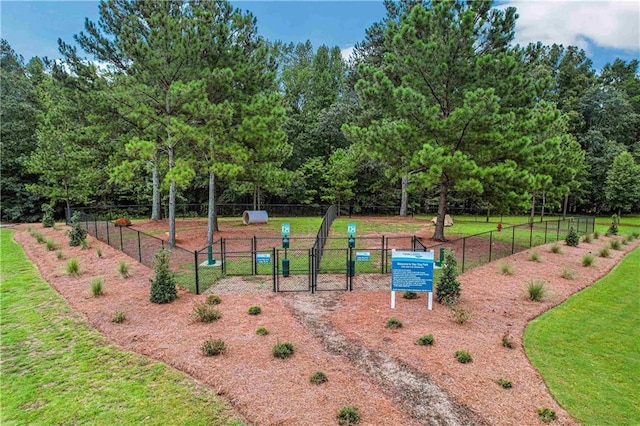 view of property's community with a lawn