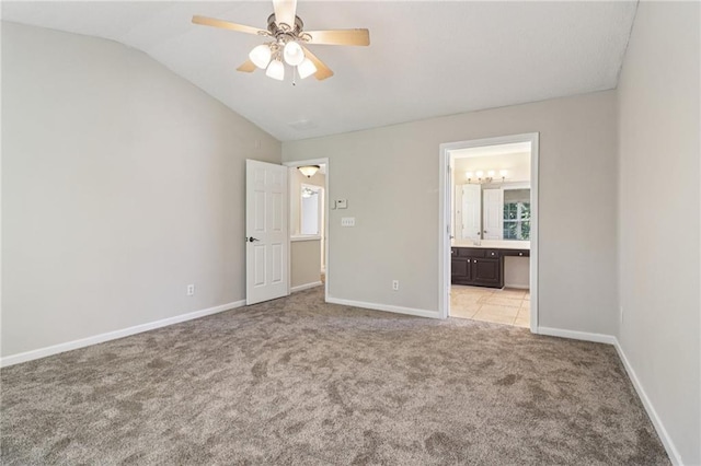 605 Alstonefield Dr, Alpharetta, GA 30004 - unfurnished bedroom featuring light carpet, vaulted ceiling, ensuite bath, and ceiling fan
