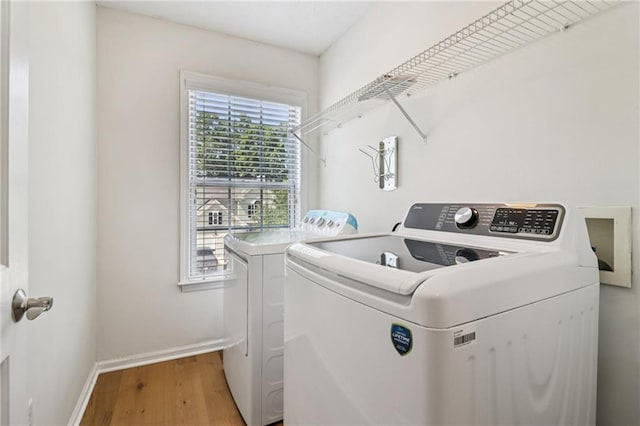 605 Alstonefield Dr, Alpharetta, GA 30004 - laundry room featuring washing machine and dryer and wood finished floors