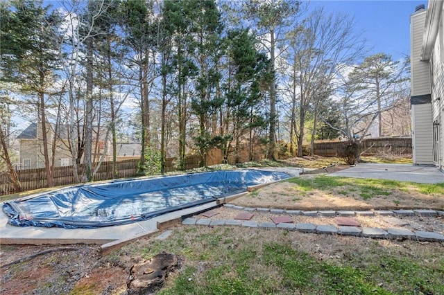 view of pool with a patio, a fenced backyard, and a fenced in pool