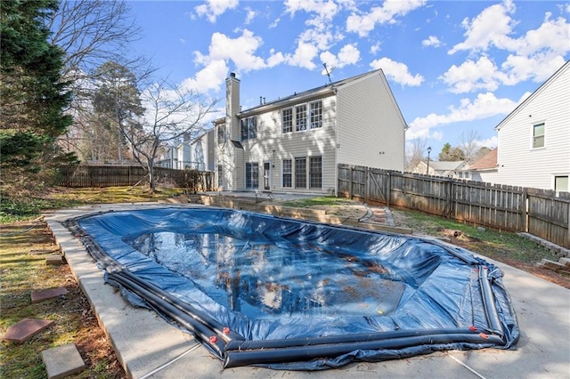 view of swimming pool with a fenced in pool and a fenced backyard