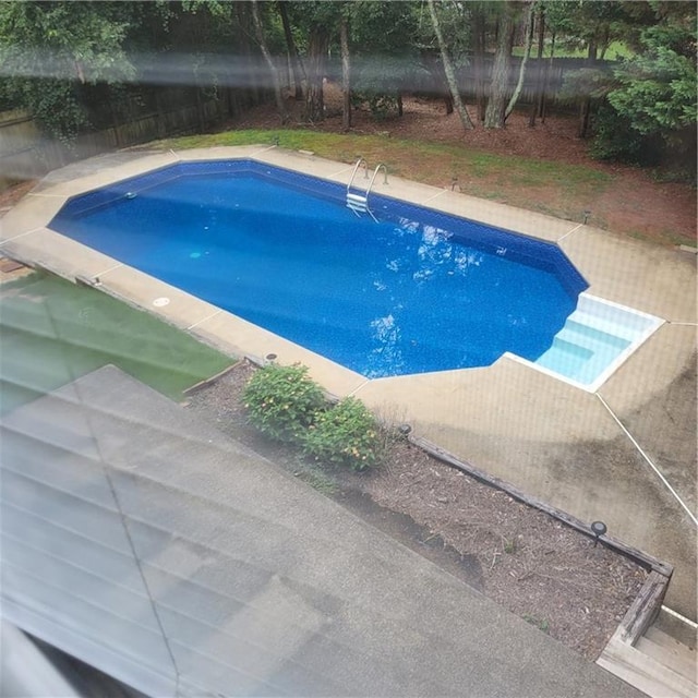 view of pool featuring a fenced in pool and fence