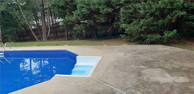 view of swimming pool featuring a fenced in pool and a fenced backyard