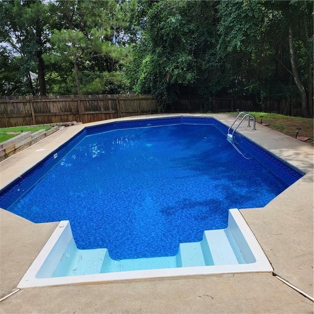 view of pool featuring a patio area, a fenced in pool, and a fenced backyard