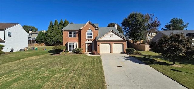 view of front of home featuring brick siding, an attached garage, a front yard, fence, and driveway