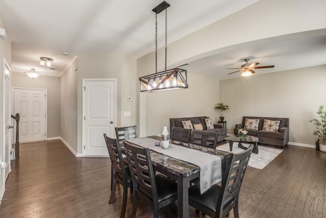 dining area with ceiling fan, crown molding, and dark hardwood / wood-style floors