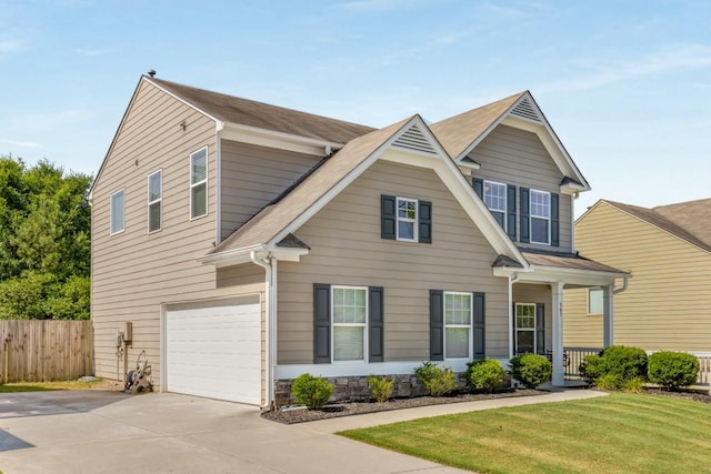 view of front of house with a front yard and a garage