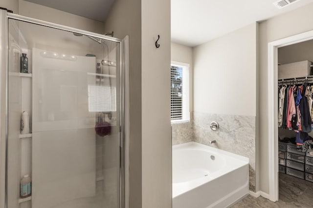 bathroom with separate shower and tub