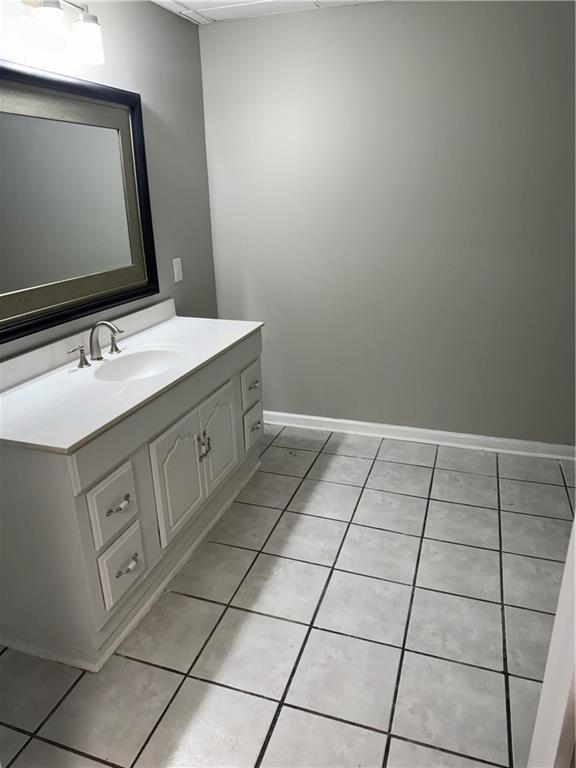 bathroom featuring vanity and tile patterned flooring