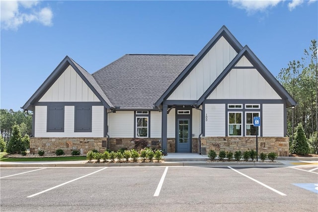 352 Foxglove Way, Mcdonough, GA 30253 - view of front of property featuring uncovered parking, stone siding, and board and batten siding