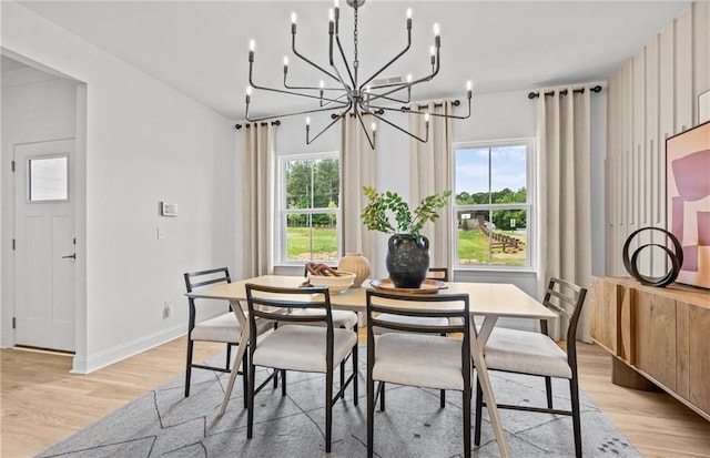 352 Foxglove Way, Mcdonough, GA 30253 - dining space featuring a chandelier, light wood-type flooring, and baseboards