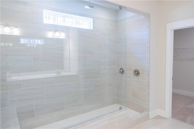 bathroom with a tile shower