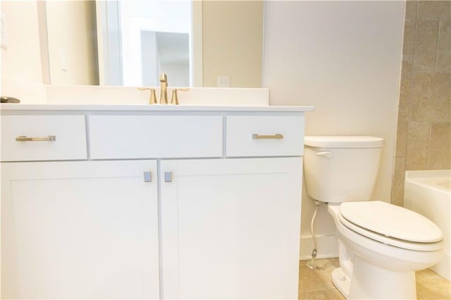 bathroom with vanity, toilet, and tile patterned floors