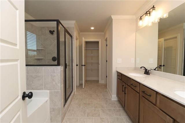 full bath with a stall shower, a sink, crown molding, a bath, and a spacious closet