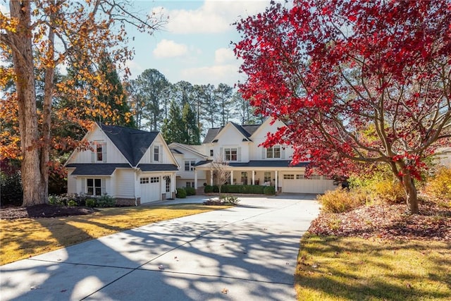 view of front of property featuring a garage and a front yard