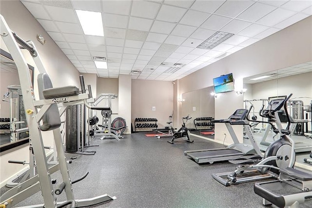 exercise room featuring a drop ceiling