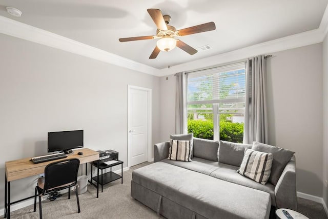 office area with crown molding, light carpet, a ceiling fan, baseboards, and visible vents