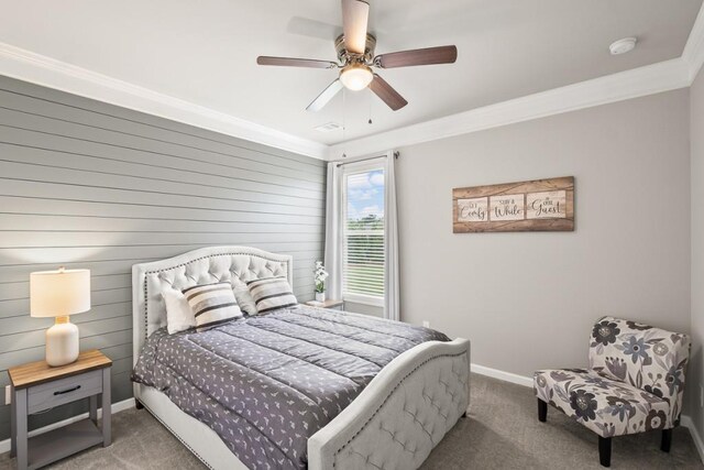 bedroom with crown molding, carpet floors, baseboards, and a ceiling fan