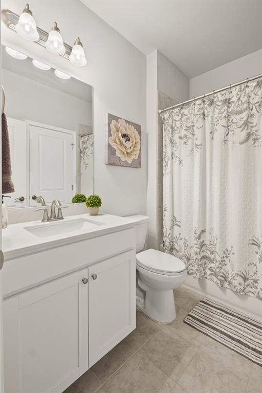 full bathroom with vanity and toilet