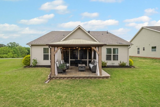 back of house with a gazebo, outdoor lounge area, a lawn, and a patio area
