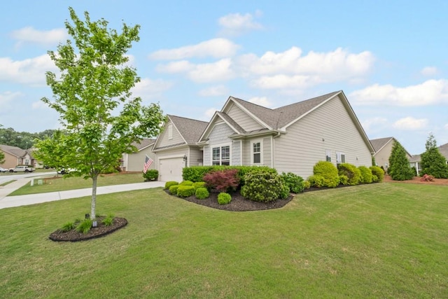 view of front of house featuring an attached garage, driveway, and a front yard