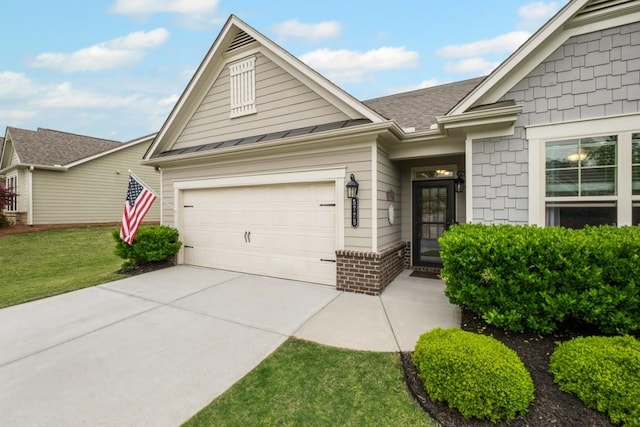 ranch-style house featuring a front lawn, a standing seam roof, brick siding, a shingled roof, and concrete driveway