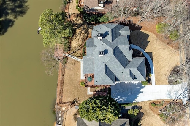 birds eye view of property featuring a water view