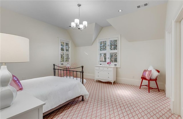 bedroom with a notable chandelier and vaulted ceiling