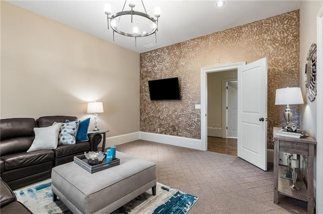 carpeted living room featuring an inviting chandelier