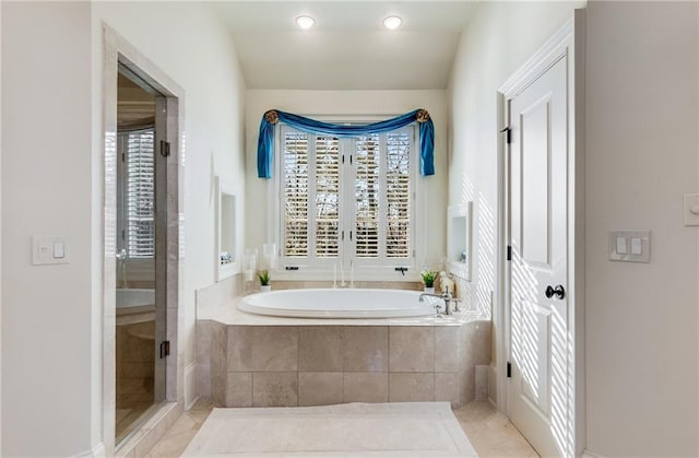 bathroom featuring tile floors and plus walk in shower