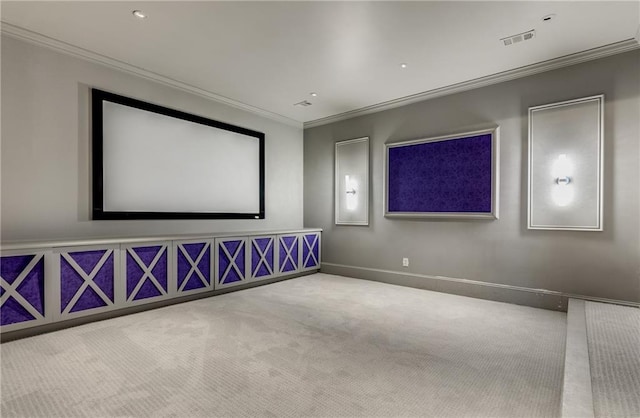 cinema room with crown molding and carpet flooring