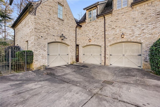 view of side of property featuring a garage