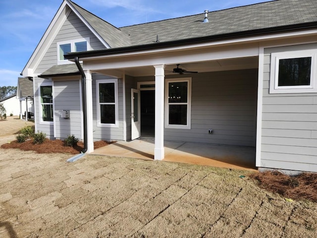 rear view of house featuring a patio area and ceiling fan