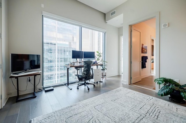 office with visible vents and wood finished floors