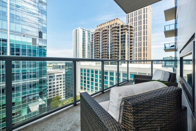 balcony featuring a city view