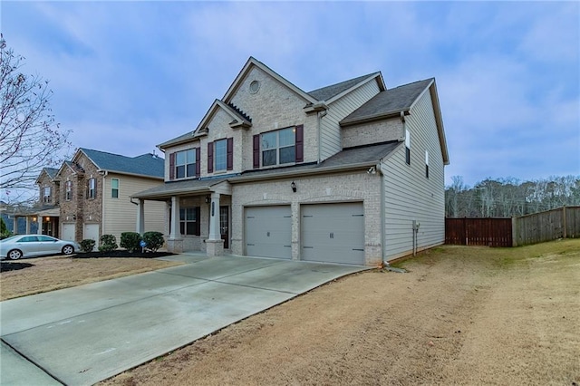 view of front of home with a porch and a garage