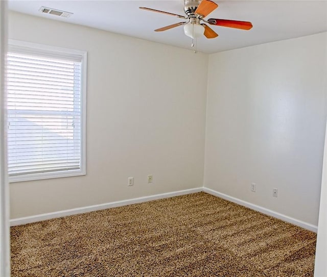 unfurnished room with carpet flooring and ceiling fan