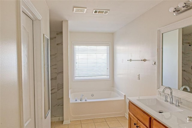 bathroom with tile patterned flooring, vanity, and separate shower and tub