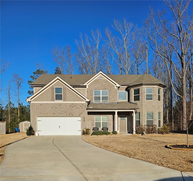 view of front of house with brick siding, driveway, and a garage