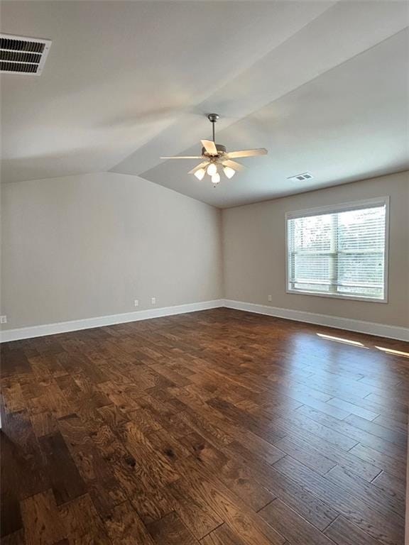 empty room with visible vents, baseboards, ceiling fan, and dark wood-style flooring